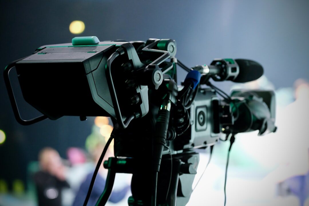 Camera-ready broadcast news desk with professional lighting and equipment